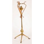Attributed to WAS Benson, a copper and brass oil lamp, on four feet, 70.