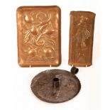 An Arts & Crafts copper circular chamberstick embossed four bats,