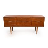 A mid-century Austinsuite sideboard or dressing chest, fitted six drawers with shaped handles,