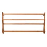 Ercol, a mid-1950s elm hanging plate rack of two shelves, blue label to back, 96.