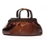 A Gucci brown leather doctor's bag with wooded handles and trim CONDITION REPORT: