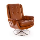 Schreiber, a tan leather swivel easy chair, 1970s, with buttoned back, seat and arms,