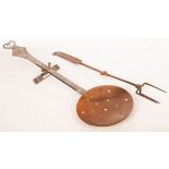 An Arts & Crafts style copper chestnut roaster with steel handle, marked WP03, 70.