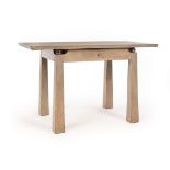 A contemporary limed oak and steel table fitted a central drawer,