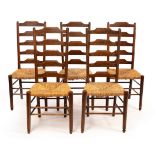 Manner of Philip Clissett (1817-1913) for Heals, a set of five oak dining chairs, with raffia seats,