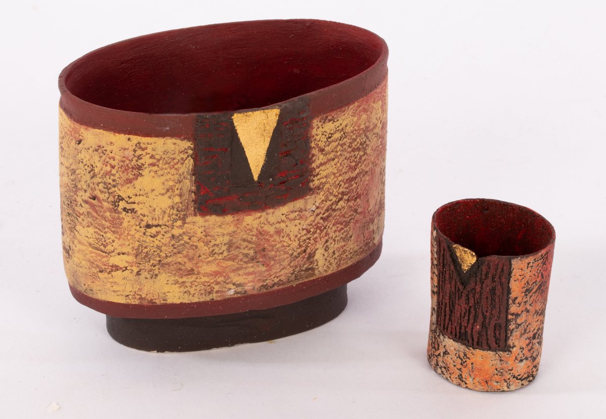 Philip Evans (born 1959), two small oval stoneware vessels with textured surface, red,