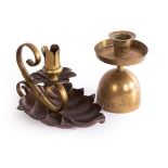 An Arts & Crafts copper and brass chamberstick, in the style of WAS Benson, of stylised leaf form,