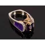 A modernist amethyst ring, the silver shank with purple enamel shoulders, stamped 925,