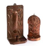 An Arts & Crafts wall sconce, embossed two stylised lilies, impressed stamp JP in oval, 35cm high,