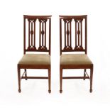 Arthur W Simpson (1857-1922), Kendal/A pair of Arts & Crafts oak dining chairs, circa 1905,