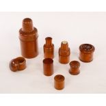 Five treen string boxes and covers, the largest 6cm high and three treen beaker boxes,