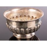 A small Victorian silver sugar bowl, HH, Sheffield 1894, of half-ribbed form, initialled EMM,