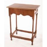 An early 18th Century walnut side table, fitted a drawer,