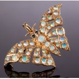 A 9ct gold butterfly pendant/brooch with sapphire eyes and opal set wings, 4cm wide approximately 5.