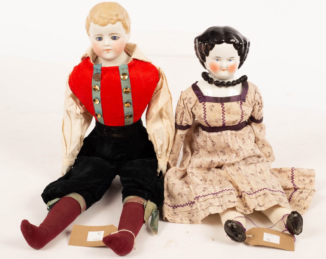 A French porcelain head doll and a bisque head doll,