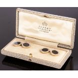 A pair onyx and diamond cufflinks, set in 18ct gold,