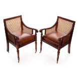 A pair of Regency style walnut bergère armchairs, by Jonathan Charles,