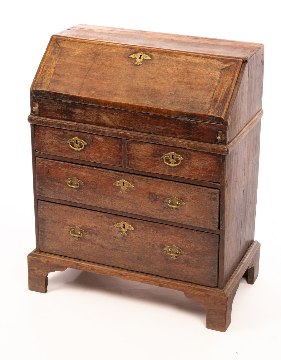 An early 18th Century oak bureau of small proportions,