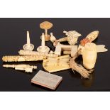 A quantity of ivory sewing accessories, including carved bodkin cases, notebook, sewing clamp etc.