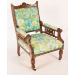 An Edwardian open armchair on turned front legs CONDITION REPORT: Condition