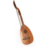 A thirteen string lute, the ivory mounted body of eleven rosewood ribs, with boxwood stringing,