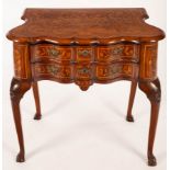 A Dutch marquetry side table, the serpentine front fitted two drawers,