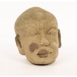 A Chinese carved stone head, Yuan dynasty,