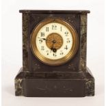 A 19th Century black slate mantel clock with cream enamel dial,