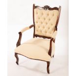 An Edwardian button back open armchair with upholstered back,
