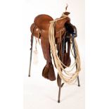 A Texas roping saddle on stand,