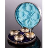 A cased set of four Victorian silver salts with spoons, IA, Sheffield 1857,