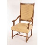 A walnut framed open armchair by Jonathan Charles, with upholstered back and seat,