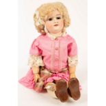 A large Armand Marseille bisque head doll with composition body,