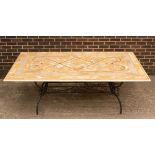 An inlaid stone top table on metal support, by Tallendi,