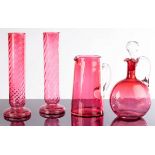 A pair of cranberry glass vases,