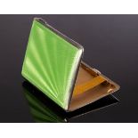 An Art Deco silver rectangular cigarette case, Birmingham 1933, with green guilloché enamel cover,