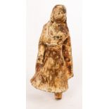 An early Indian terracotta figure of a veiled woman wearing a pleated dress, 8cm high,