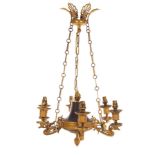 An Empire ormolu and bronze six-light electrolier, the nozzles with swan supports,