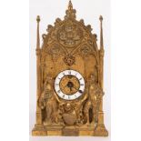 A small French Gothic table clock with poppy finial to the sides,