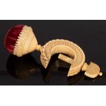 A carved ivory sewing clamp with pin cushion,