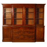 A Victorian mahogany breakfront press cupboard, the upper doors now with lattice grille fronts, 240.