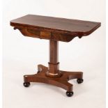 A William IV rosewood card table, the fold-over top on octagonal column to a platform base,