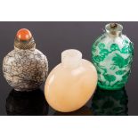 A Chinese agate snuff bottle, 6cm high, a stone snuff bottle with a red lid, 6.
