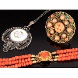 A three-strand coral bead necklace,