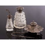 A cut glass silver topped scent bottle,