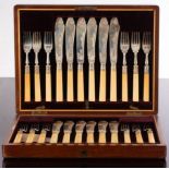 A set of twelve silver fish knives and forks, with ivory handles, HH&S, Sheffield 1907,