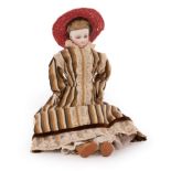 A French pressed bisque head fashionable doll with chamois body, in a long brown dress,