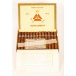 An open, boxed set of twenty-five Montecristo No.