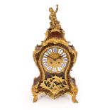 A Boulle type eight-day mantel clock in a tortoiseshell and gilt metal case,