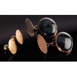 A pair of cat's eye cabochon cufflinks, set in 9ct gold, approximately 5.